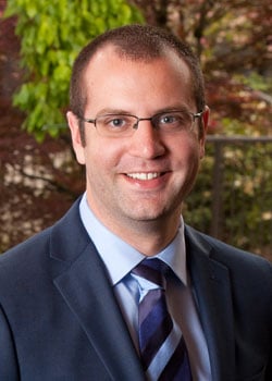 Dr. Kevin Sweeney - Oral Surgeon, smiling at the camera