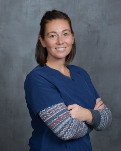 Becky - Surgical Assistant, smiling at the camera