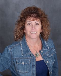 Cheryl - Financial Coordinator, smiling at the camera