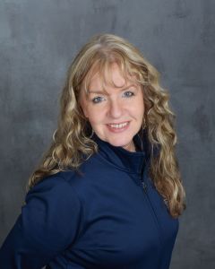 Nanci - Surgical Assistant, smiling at the camera